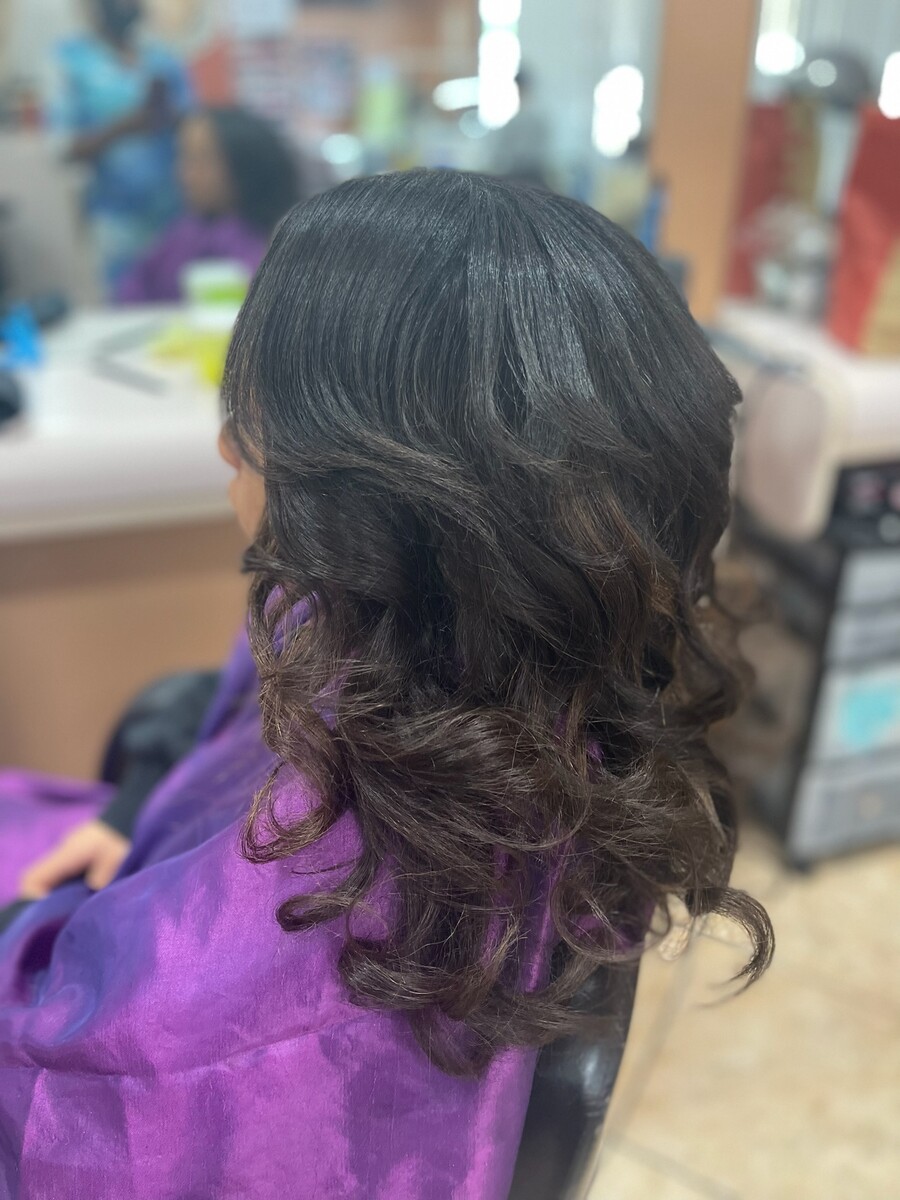 Short natural coils transformed with smooth chest-length extensions, after