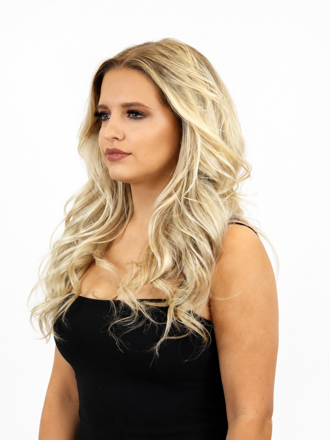 Straight blonde hair to the waist, seen from the side