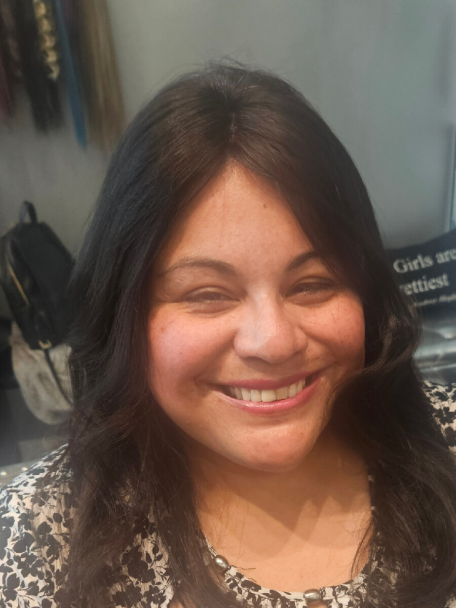 Full dark shoulder-length hair with soft waves, after