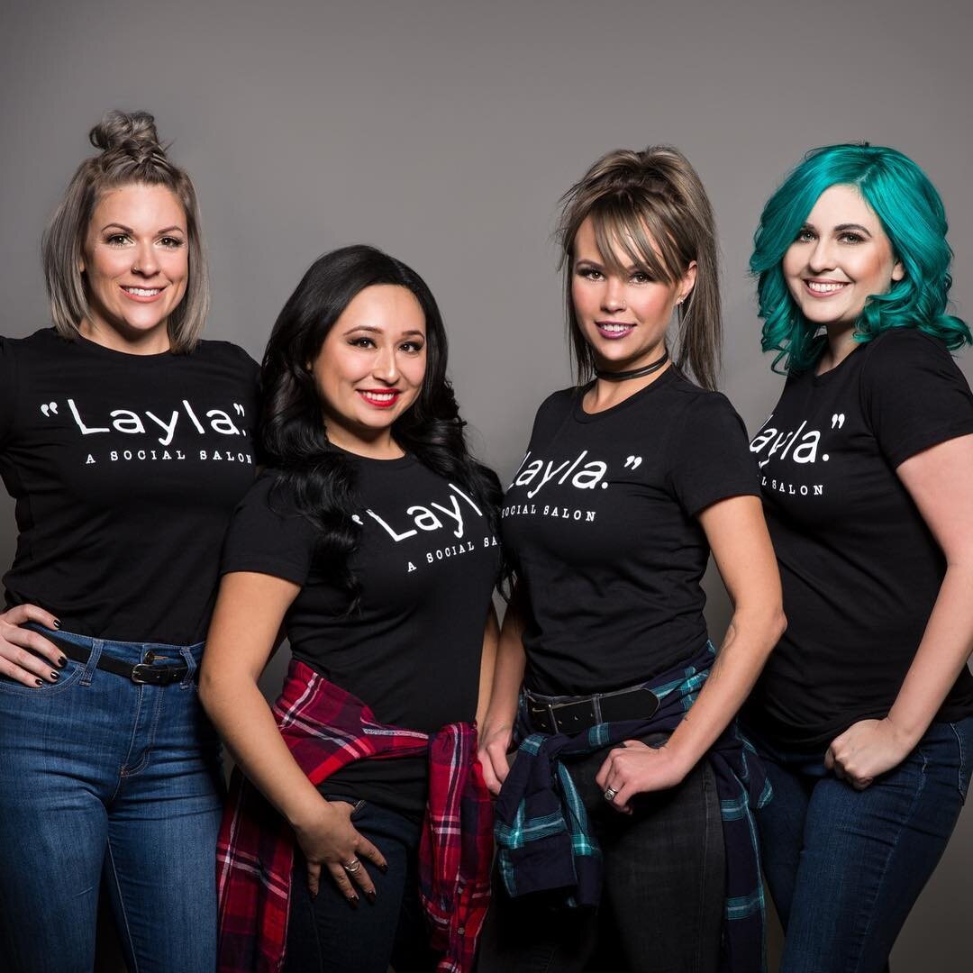 Four Layla stylists in black Layla tees and jeans