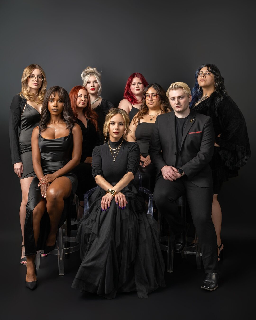 The Layla A Social Salon team in black, posed together on stools