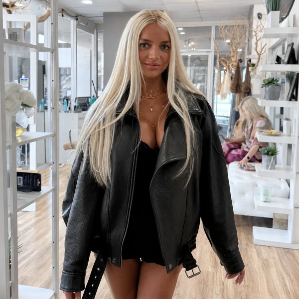 After: long platinum-blonde extensions, photographed in the salon