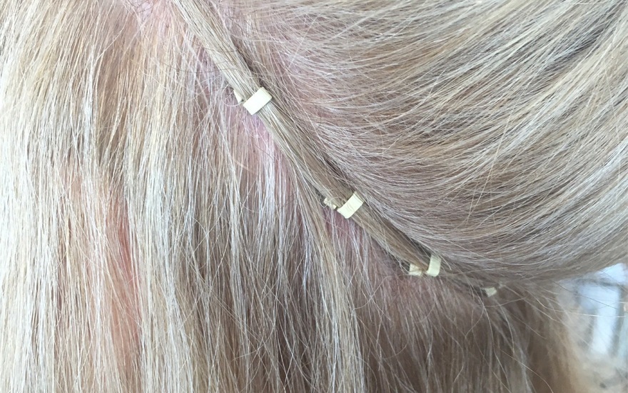 Individual I-tip strands threaded through microlink beads